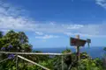 Wegweiser mit den Ortsangaben Calhau und Sao Jorge, im Hintergrund der Atlantik.